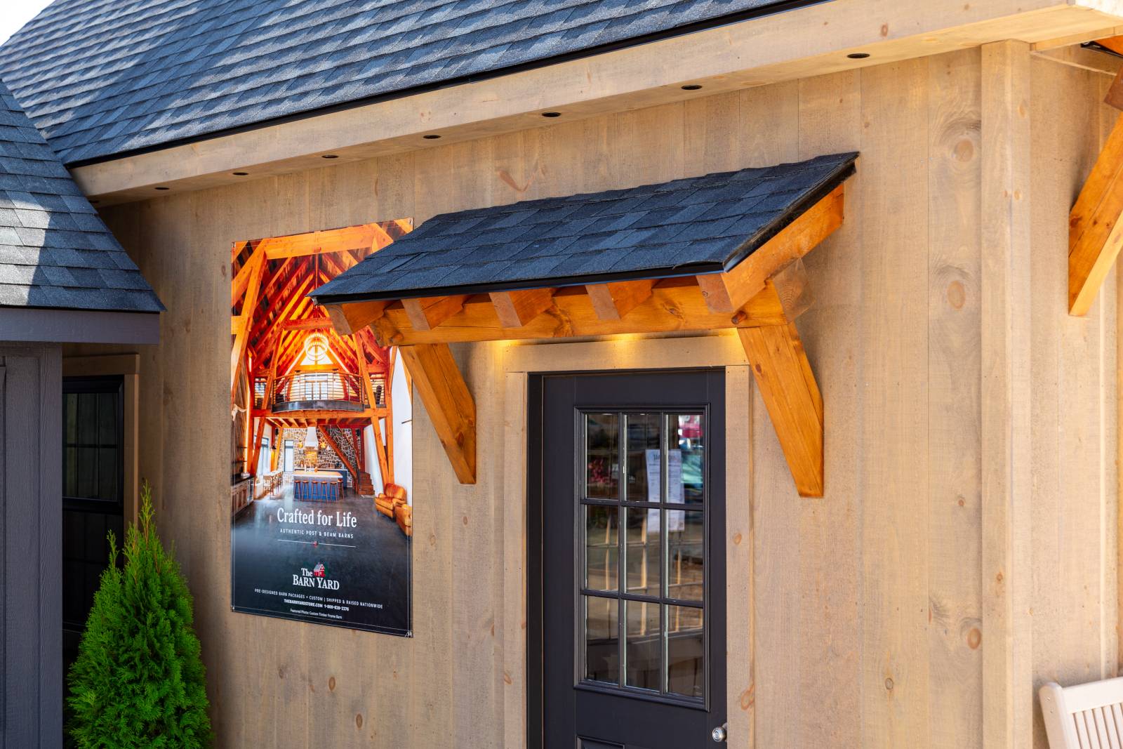 Timber Frame Eyebrow Roof Over the Entry Door