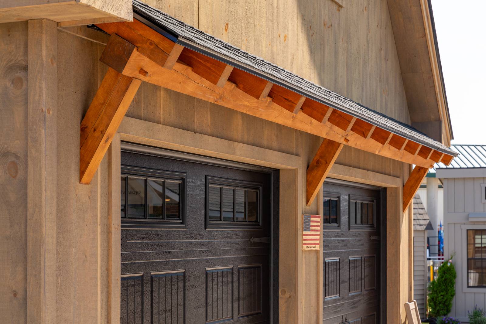 Timber Frame Eyebrow Roof Above Overhead Doors