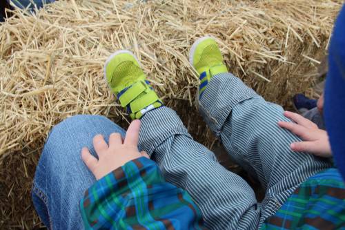 Little feet on the hay bale