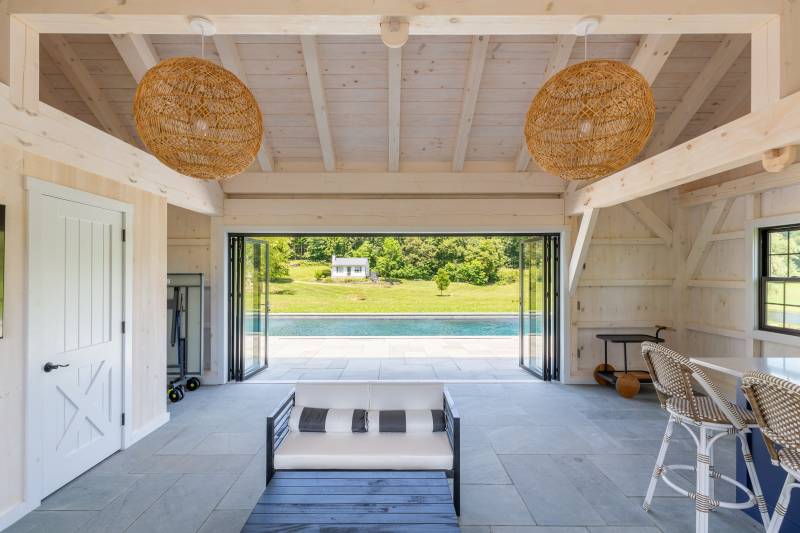 Looking Out of the NanaWall Doors • Timber Frame Pool House