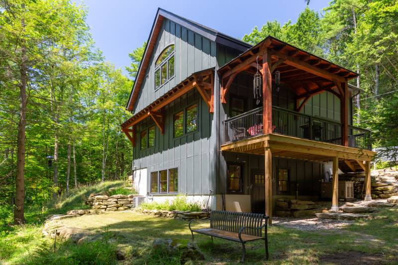 All Three Floors Visible • Timber Frame Eyebrow Roof & Covered Entry